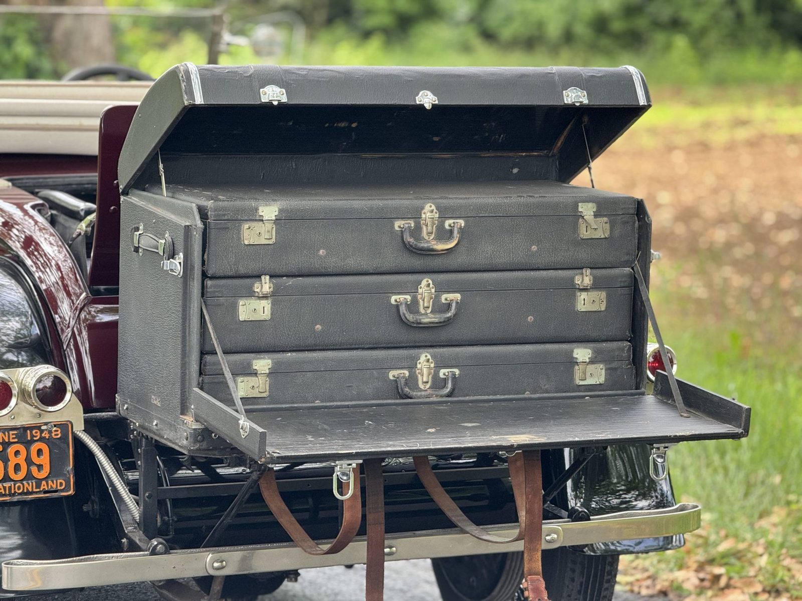 Rear luggage trunk fitted with three suitcases on the Silver Ghost