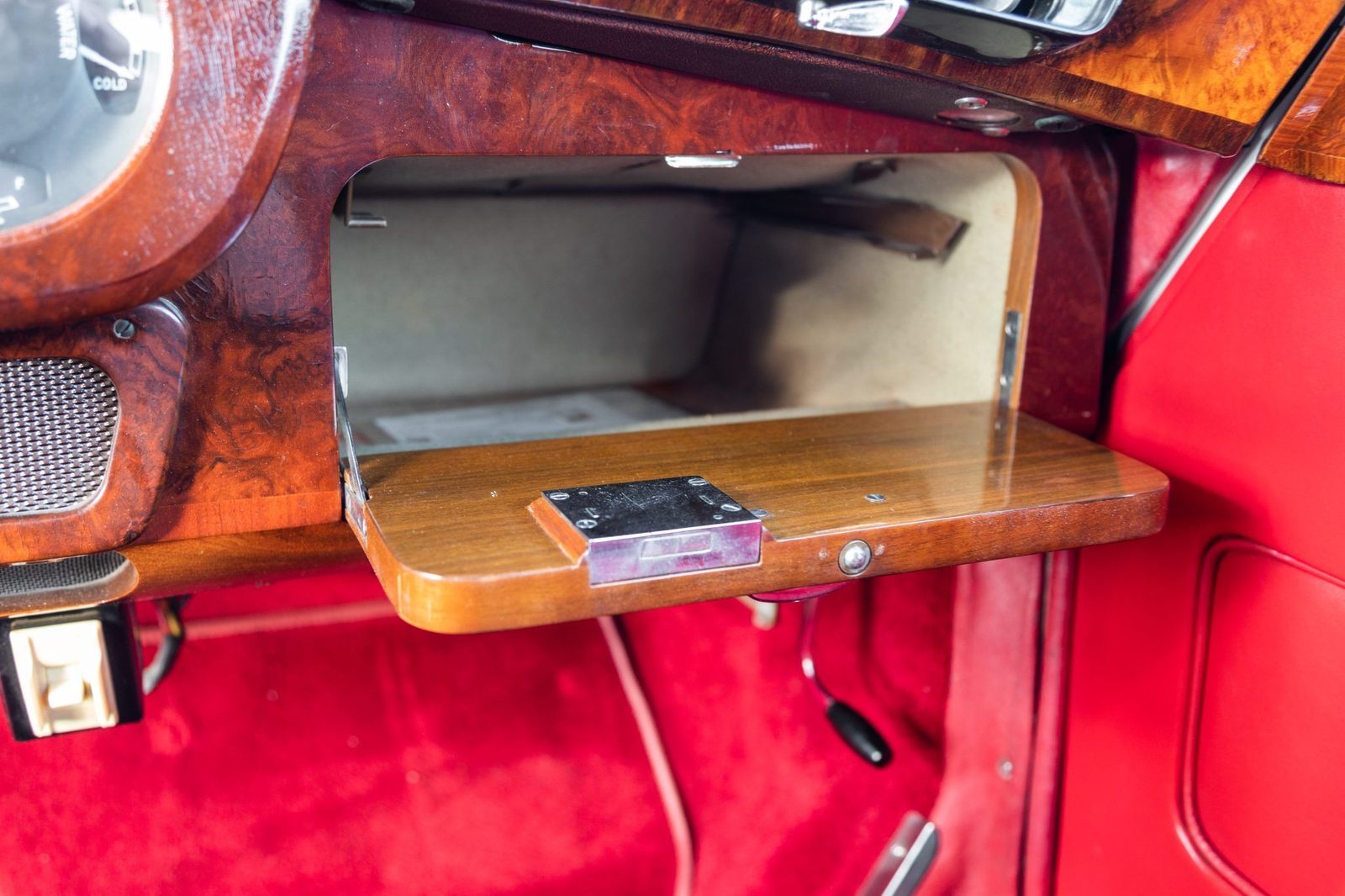 Fold-out burl wood picnic table in the Silver Cloud II rear cabin